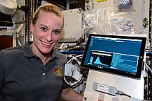 American astronaut Kate Rubins with a MinION sequencer on the ISS in August 2016. First-ever sequencing of DNA in space, performed by Kate Rubins on the ISS. 128f0462 sequencer 1.jpg