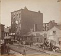 Five Points brick tenements began replacing older wooden buildings; the southwest corner of Mulberry Bend in Five Points with Orange Street running north