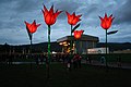 Greenbelt 2012 festival art flowers and "Main Stage".jpg