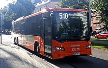 A bus operating trunk line 510 in Sornainen. Note the orange colour and green arrow stickers on the front and middle doors. Helsinki bus line 510.jpg