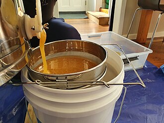 Using a honey extractor to process honeycomb from urban hives in Auckland, New Zealand Honey processing 20220220 160604.jpg