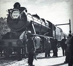 Israel Railways 8F 70513 (NBL 24721 of 1941), taking water at Zichron Ya'akov on 4 January 1949. This was one of 24 WD 8Fs sold to Palestine Railways after wartime service in Iran and Palestine. IL steam engine.jpg