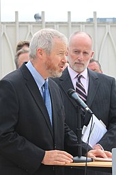 Mike McGinn, left, with Tim Burgess, right Initiative to promote tourism in Seattle, 2011-07 (5981439961).jpg