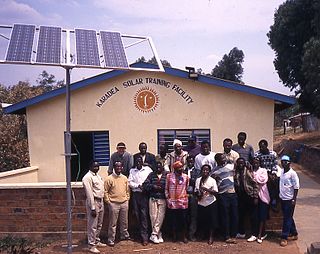 Solar training course at the KARADEA Solar Training Facility (KSTF), 1996, Makale (front row, first on right), Daniel Kithokoi (back row, first on right) Mark Hankins (back row, first on left) KARADEA Solar Training Facility.jpg