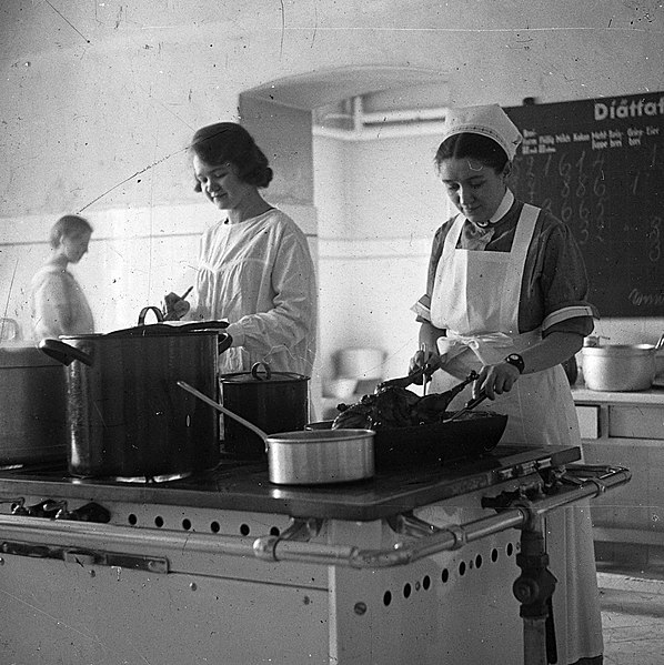 File:Kitchen, woman, pot, cooking, fireplace, nurse Fortepan 20153.jpg