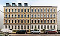 Double apartment building in open development with front gardens and enclosure (at No. 51)