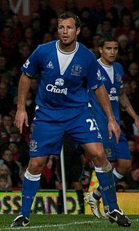 Neill and national teammate Tim Cahill playing for Everton in 2009 Lucas Neill Everton cropped.jpg