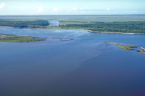 The MRGO and an outlet into Lake Borgne, approximately 50 miles (80 km) up the canal from its mouth and 15 miles (24 km) east of New Orleans (view tow