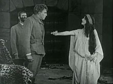 'She' (Marguerite Snow) offers the dagger to Leo Vincey (James Cruze) Marguerite Snow as She 1911.jpg