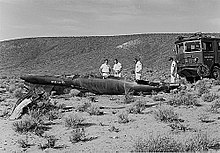 Firefighters survey the wreckage of Adams's X-15