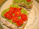 Open faced tuna sandwich with cherry tomato and guacamole spread.jpg