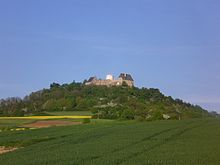 Extinct volcano Otzberg and the old fort Veste Otzberg with the white tower Otzberg panoramo 2.jpg