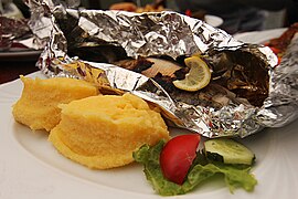 Mămăligă and trout wrapped in tinfoil