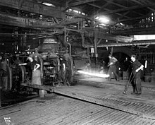 Rolling bars in Irondale Pacific Steel Co rolling bars, Seattle (CURTIS 836).jpeg