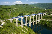 A TGV Duplex crossing the Cize-Bolozon viaduct. The train can reach a maximum speed of 360 kilometres per hour (220 mph). SNCF TGV Duplex Viaduc de Cize - Bolozon.jpg