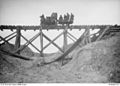 Simplex, 20 hp narrow gauge locomotive tractor, pulling Australians over a trestle bridge at Tincourt.JPG