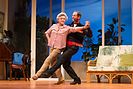 Todd McKenney (red rose in mouth) and Nancye Hayes dancing in a performance of the play Six Dance Lessons in Six Weeks