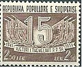 Stamp of Albania - 1957 - Colnect 340686 - Number 15 surrounded by flags and ribbon.jpeg