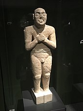 The "Worshipping Servant" statue (2500 BC), above one metre (3 ft 3 in) in height, is much taller than any possible Mesopotamian or Harappan models. Photo courtesy of the National Museum of Korea. Statue at National Museum of Korea.jpg