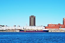 Asphalt Princess next to the Radio Canada Building in Montreal, Canada in September 2012 Tanker and Radio Canada Building in Montreal - panoramio.jpg