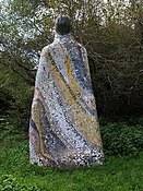 Katy Hallet, The Guardian, mosaic sculpture. On the Tarka Trail by Ladywell Wood. The lettering includes quotes from Tarka the Otter.