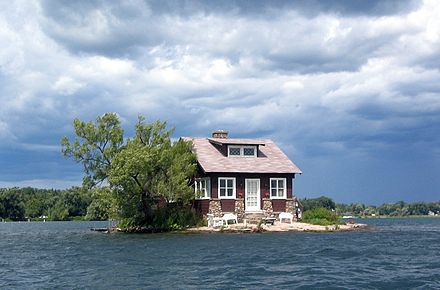 "Just Room Enough", an island with a house and one tree