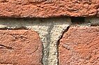 Three old bricks held together with mortar.jpg