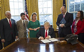 President Trump signing Executive Order 13772.