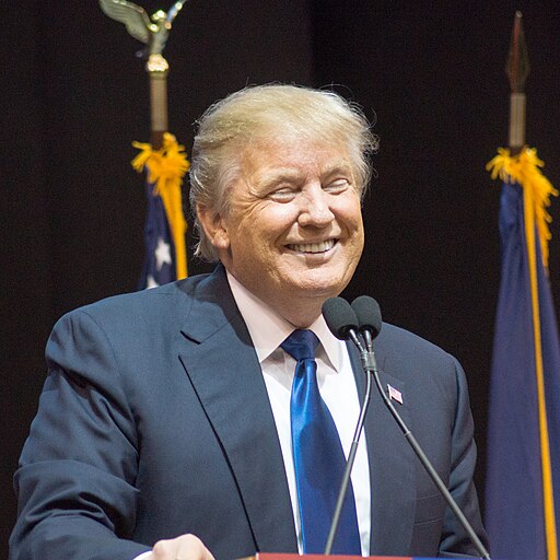 Trump smiling with eyes closed