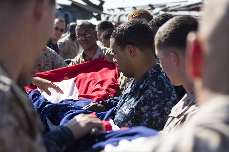 File:U.S. Marines and Sailors assigned to the 26th Marine Expeditionary Unit (MEU), and Sailors assigned to the USS Kearsarge (LHD 3), fold the American flag to commemorate the Fourth of July during their 2013 130704-M-BS001-007.jpg