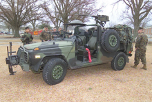 The Mercedes-Benz GDT-290 "Interim Fast Attack Vehicle" (IFAV) is a replacement of the Chenowth FAV desert buggy and the modified M-151A2 jeep), c. 2001 USMC IFAV.PNG