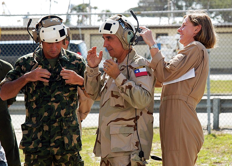 File:US Navy 090425-N-5677B-033 A U.S. Marine Corps MV-22 Osprey crewmember assists Armada de Chile Rear Adm. Cristian Del Real, center, and Fuerzas Armadas del Uruguay Capt. Rubens Romanelli before their flight aboard an Osprey ver.jpg