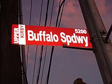 An Upper Kirby street sign (in the classic red that distinguishes the Upper Kirby district from its surrounding areas) showing Buffalo Speedway UpperKirby.JPG