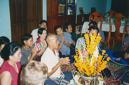 A baci rite conducted by a family in Vientiane.