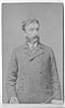 formal photo of a standing man wearing a jacket