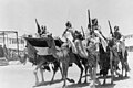 'Coronation' of King Abdullah in Amman on May 25, '46. Colour party 'lowering the colours' when passing saluting base before king. Corps Elite LOC matpc.22547 (cropped).jpg