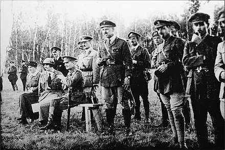 Kolchak (seated), Anna Timiryova and General Alfred Knox (behind Kolchak) observing a military exercise in 1919