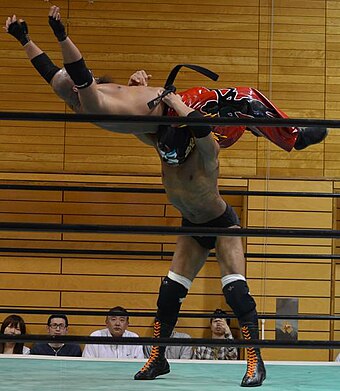 The Great Sasuke performing a thunder fire powerbomb.