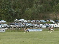 A Traralgon player is followed closly by a Moe player in the third quarter.