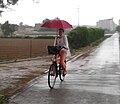 2017 05 18 Ciclista amb paraigües per la Via Xurra 01 (cropped).jpg