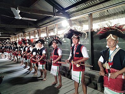 A group of Adi men performing war dance, Rungmong village, Upper Siang district