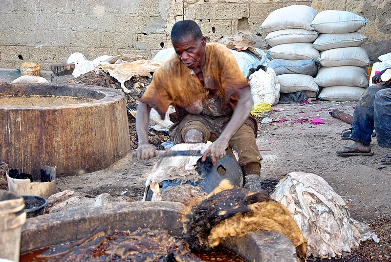 File:A man processing hide and skin to leather.jpg