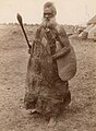 Aboriginal man carrying a shield, waddy and boomerang, South Australia, ca. 1875.jpg