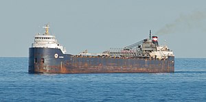 Blue and white cargo ship on water