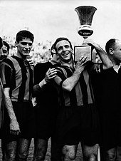 Atalanta players Angelo Domenghini and Piero Gardoni hoisting the 1962-63 Coppa Italia after defeating Torino 3-1 in the final Atalanta BC - 1962-63 Coppa Italia - Angelo Domenghini and Piero Gardoni.jpg