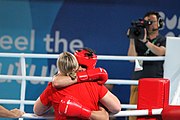 Deutsch: Boxen bei den Olympischen Jugendspielen 2018 Tag 12, 18. Oktober 2018 - Kampf um Bronze im Leichten Weltergewicht Jungen – Hassan Azim (Großbritannien, rot) schlägt Mohammed Boulaouja (Marokko, blau) RSC; Ringrichter ist Wulfren Olivares Peréz (Kolumbien). English: Boxing at the 2018 Summer Youth Olympics on 18 October 2018 – Bronze Medail Match Light Welterweight Boys - Hassan Azim (Great Britain, red) beats Mohammed Boulaouja (Morocco, blue) RSC; Referee is Wulfren Olivares Peréz (Columbia). Español: Boxeo en los Juegos Olímpicos Juveniles de Verano de 2018 en 18 de octubre de 2018 - Medalla de bronce de los hombres ligeros de peso welter: Hassan Azim (Gran Bretaña, rojo) vence a Mohammed Boulaouja (Marruecos, azul) RSC; El árbitro es Wulfren Olivares Peréz (Colombia).