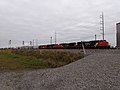 A 4-locomotive lashup leads this manifest, including SD75s, a C40-8W, and a GP38-2