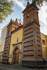 Baroque brick Parish of San Sebastián Mártir, Xoco in Mexico City, was completed in 1663[31]
