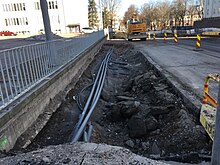 Conduits under sidewalk under construction (43196443984).jpg