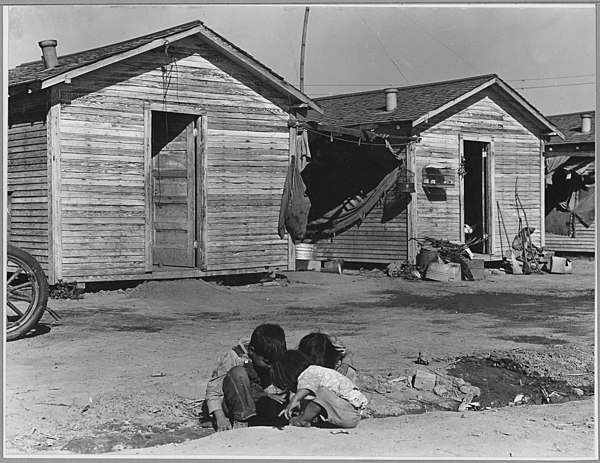 Mexican children in a segregated company housing facility in Corcoran, California (1940)